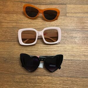 Three pairs of sunglasses price listed for all of them